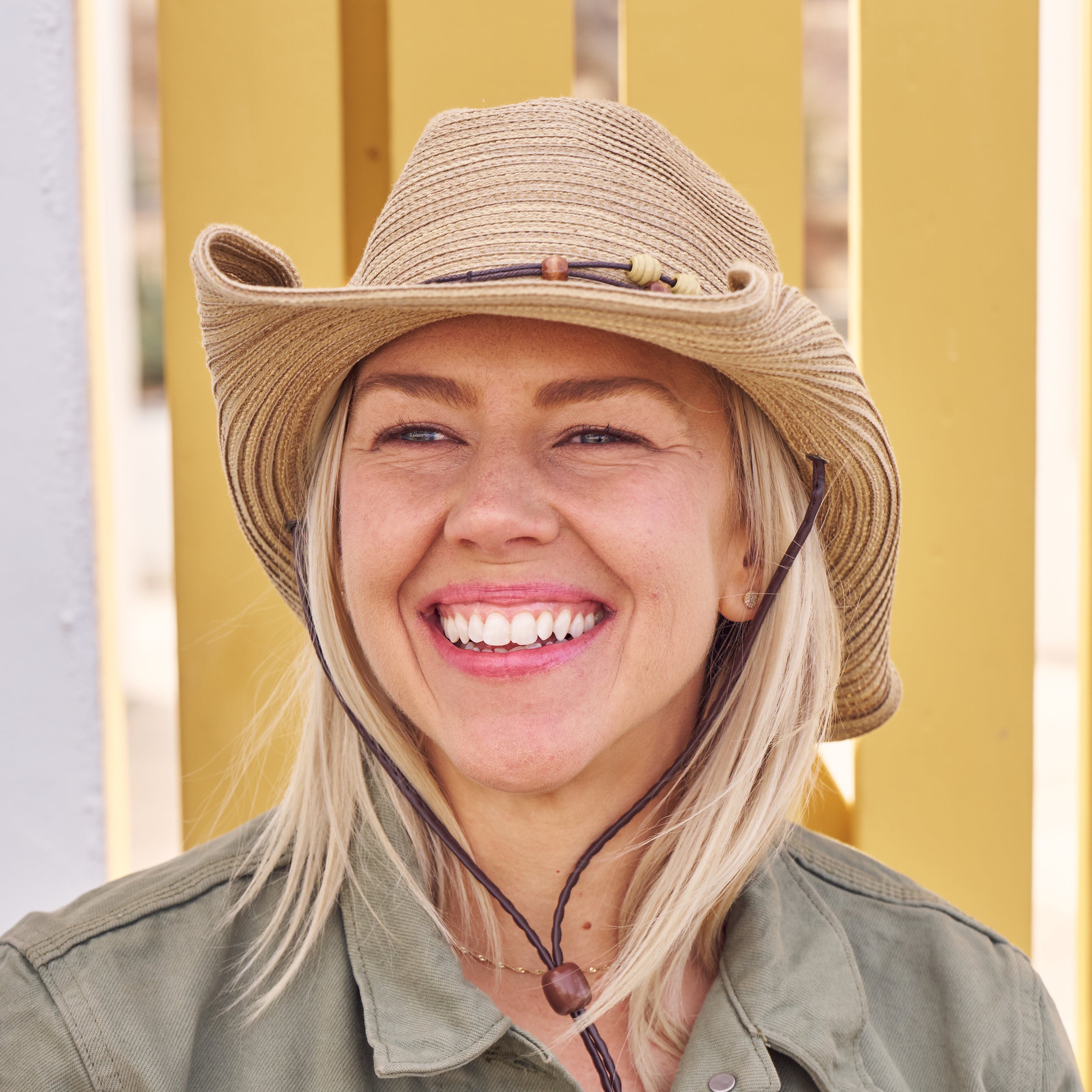 Woman wearing a Sunday Afternoons Sunset Hat.