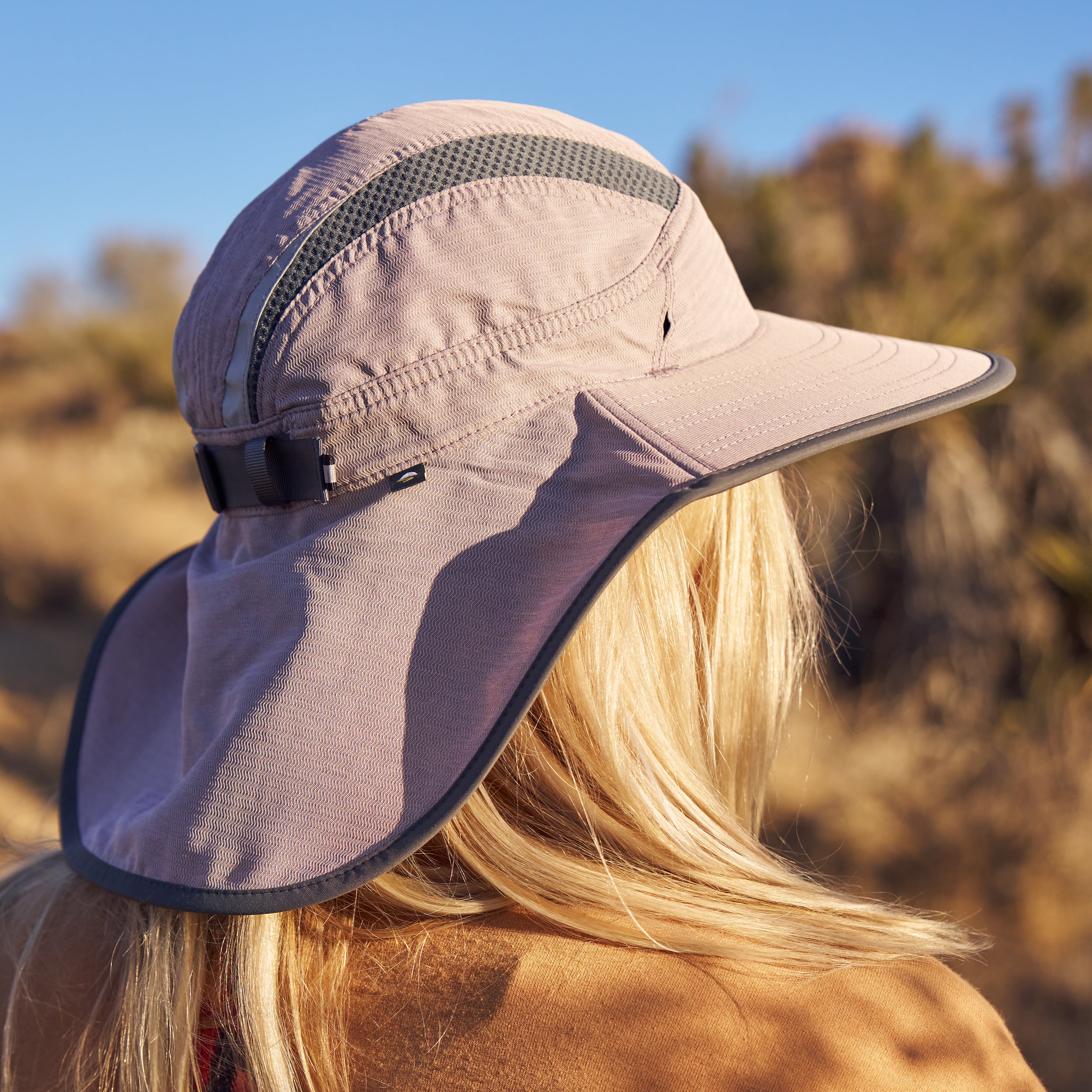 A woman turned away showing the back of a Sunday Afternoons Ultra Adventure Hat